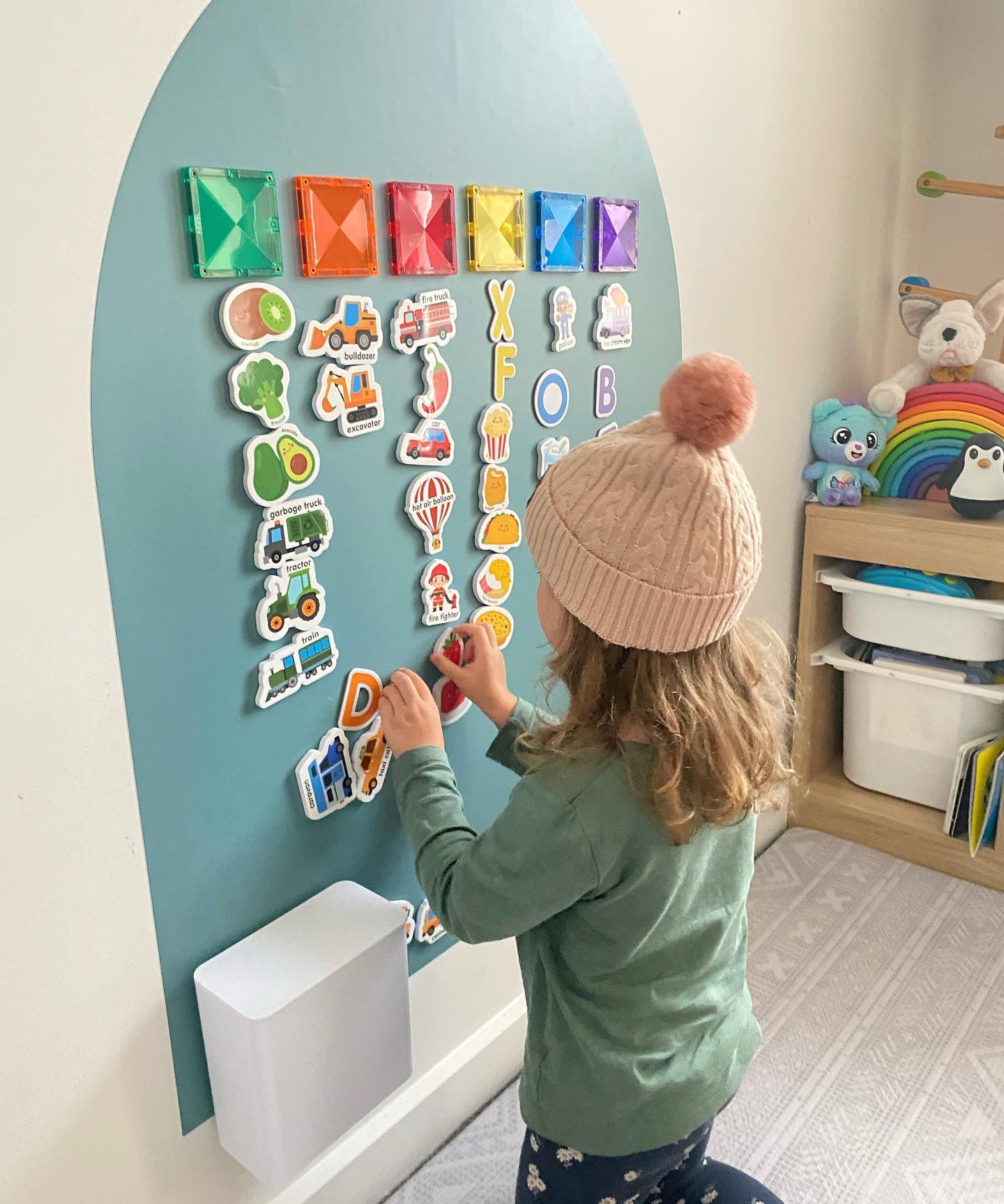 Child playing on the MagPlay Wall + Board Bundle magnetic playwall