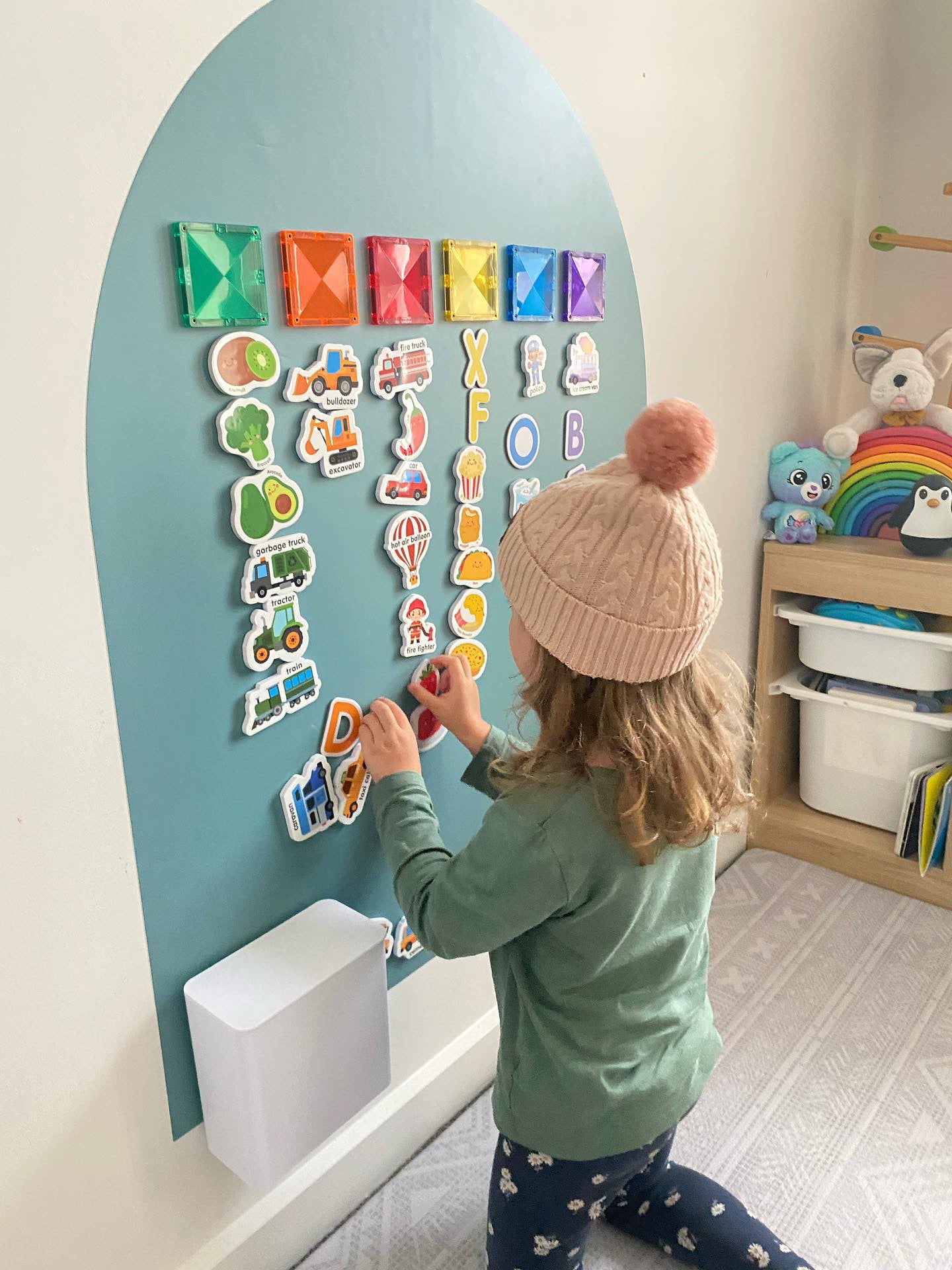 Child playing on the MagPlay Wall + Board Bundle magnetic playwall
