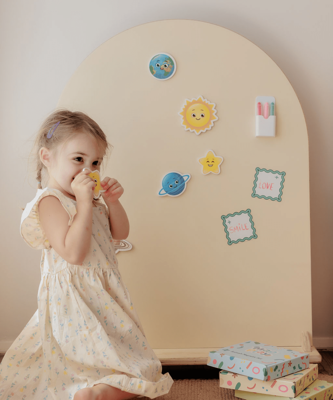 Child playing at the MagPlay Wall + Board + Stand Bundle