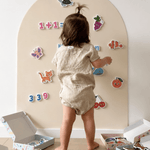 Child playing with magnets on the MagPlay Wall magnetic playwall